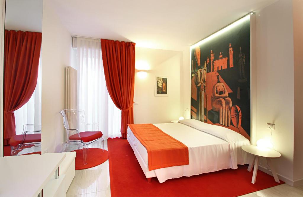 Łóżko lub łóżka w pokoju w obiekcie Ferrara Rooms
