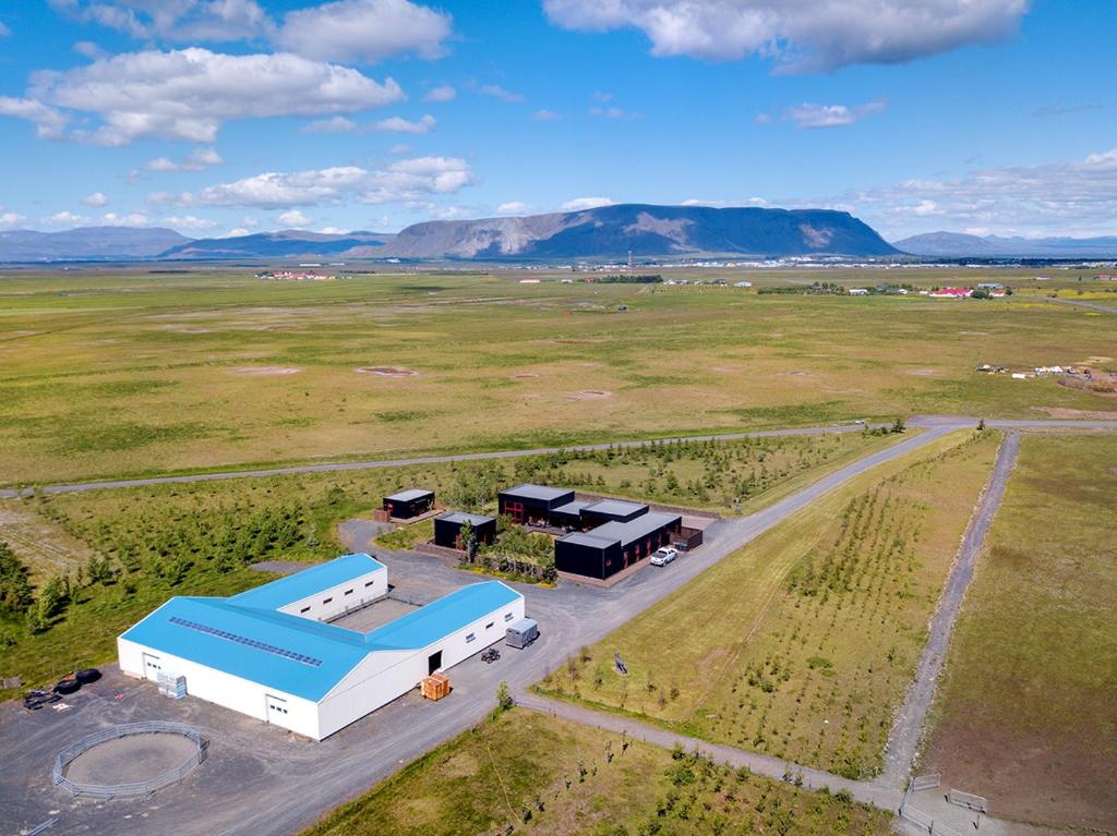 an aerial view of a farm with a building at Hrafntinna Villa in Selfoss