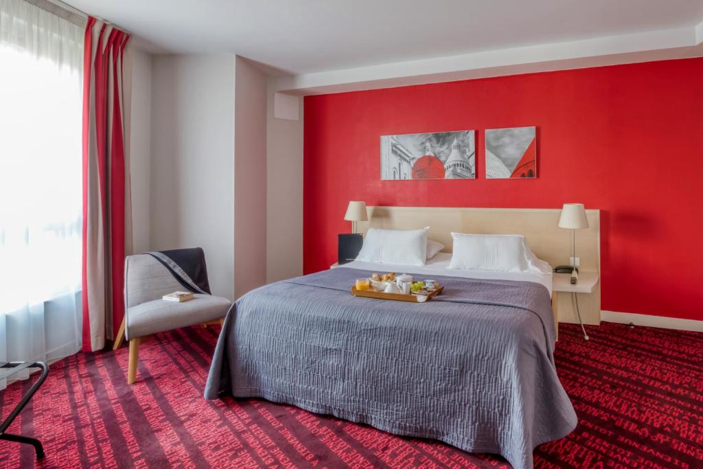 Ein Bett oder Betten in einem Zimmer der Unterkunft Hotel Le Richemont