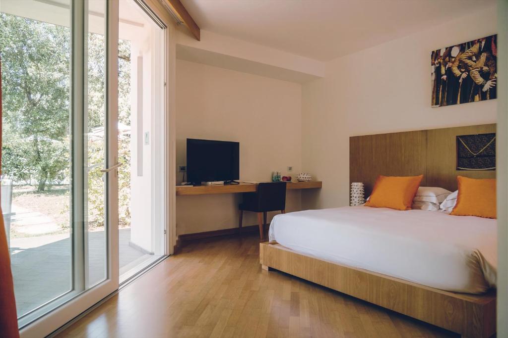 Postel nebo postele na pokoji v ubytování Lanthia Resort