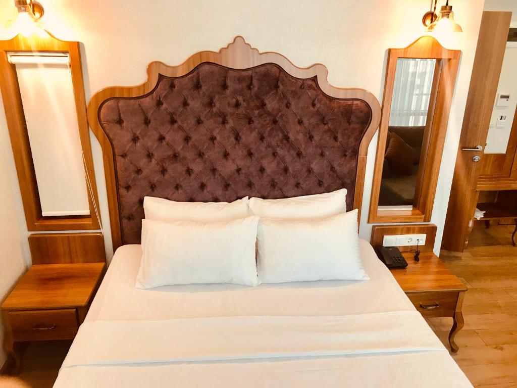 A bed or beds in a room at The Meretto Hotel Istanbul Old City