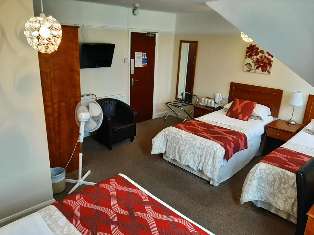 Postel nebo postele na pokoji v ubytování The Sportsview Guest House