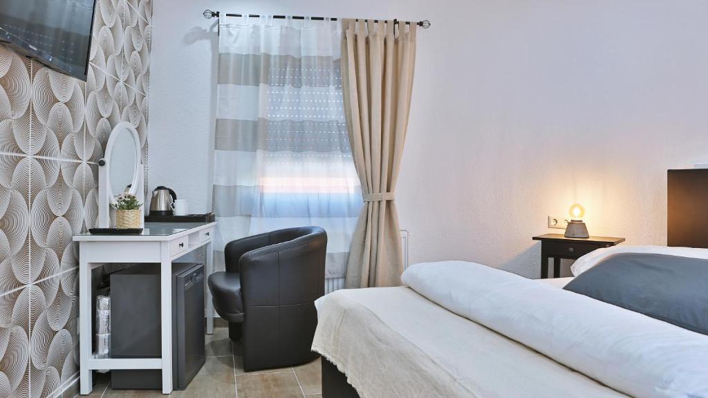 Ein Bett oder Betten in einem Zimmer der Unterkunft Hotel Frankenthaler Hof