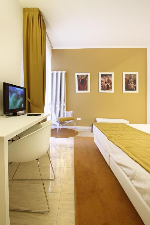 Telewizja i/lub zestaw kina domowego w obiekcie Ferrara Rooms