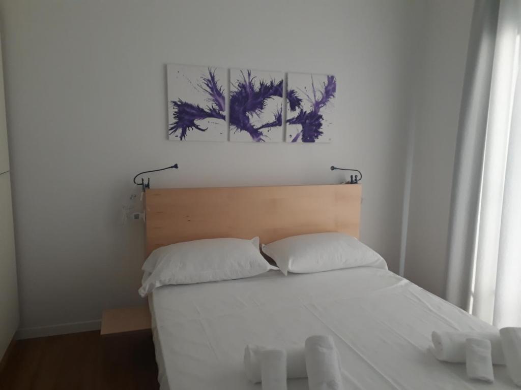 Postel nebo postele na pokoji v ubytování Luna Blu