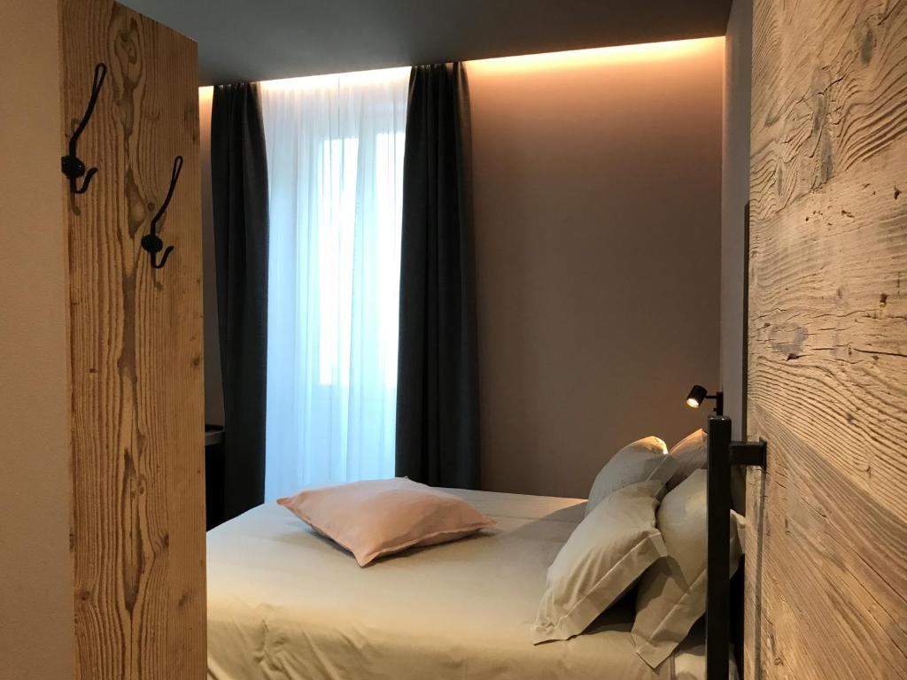 Postel nebo postele na pokoji v ubytování Hotel san Vitale