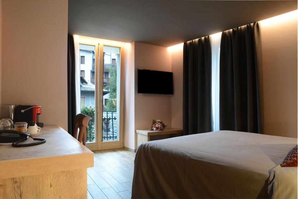 Postel nebo postele na pokoji v ubytování Hotel san Vitale
