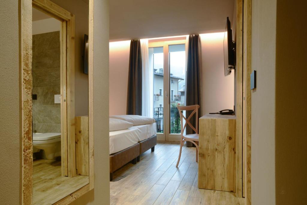 Postel nebo postele na pokoji v ubytování Hotel san Vitale