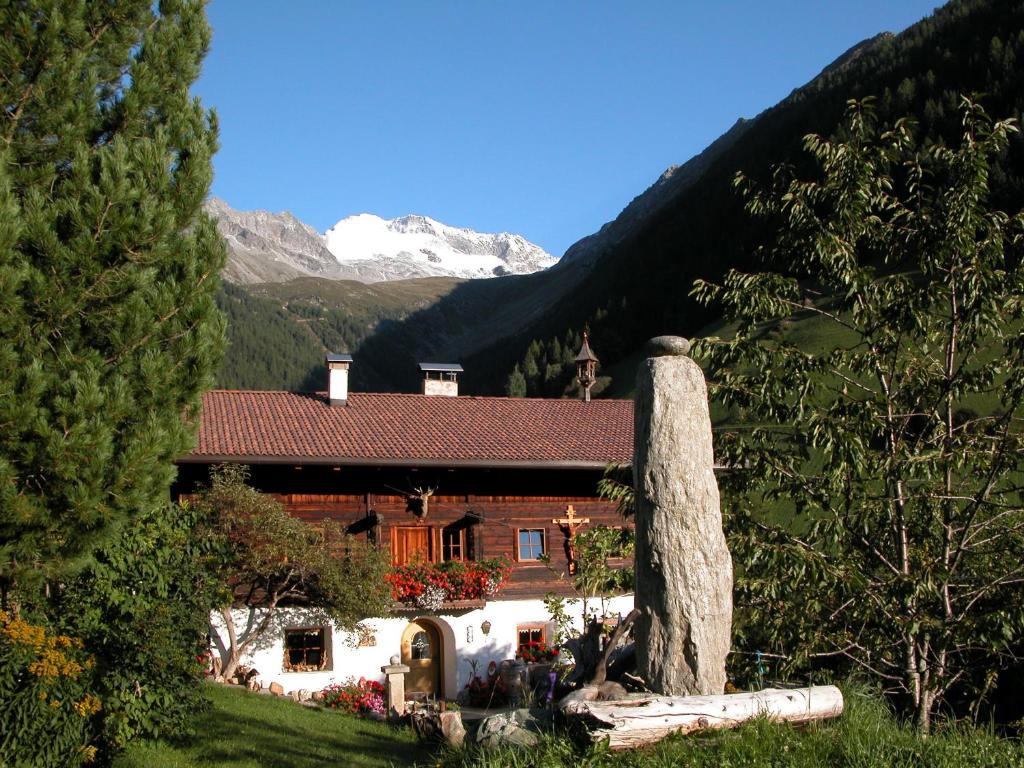 a house in the middle of a mountain at Feichterhof in Rio Bianco