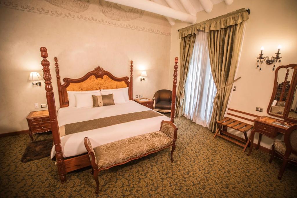 Postel nebo postele na pokoji v ubytování Aranwa Cusco Boutique Hotel