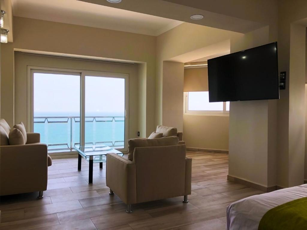 TV a/nebo společenská místnost v ubytování Hotel Lois Veracruz
