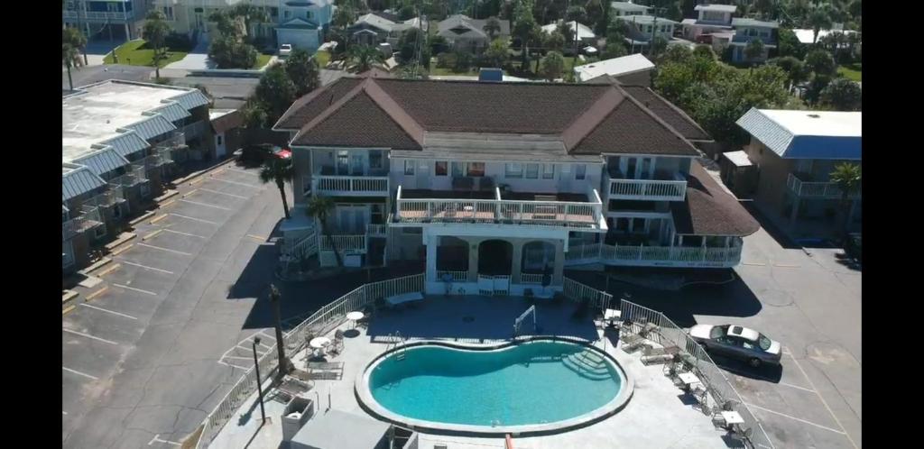 an aerial view of a large house with a swimming pool at Topaz Motel - Flagler Beach in Flagler Beach