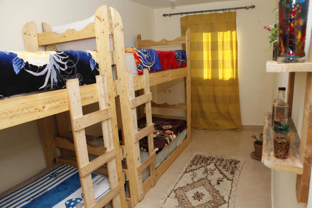 Postel nebo postele na pokoji v ubytování Tayought Surf House