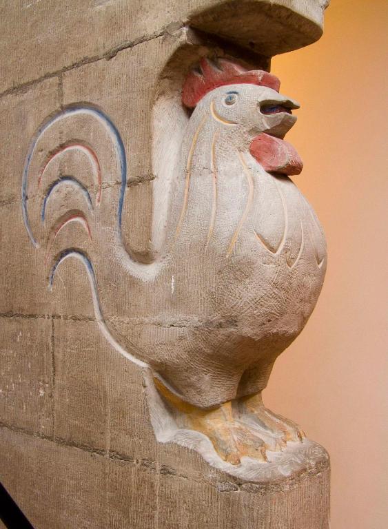 a statue of a chicken sitting on a post at Hotel d'Allèves in Geneva