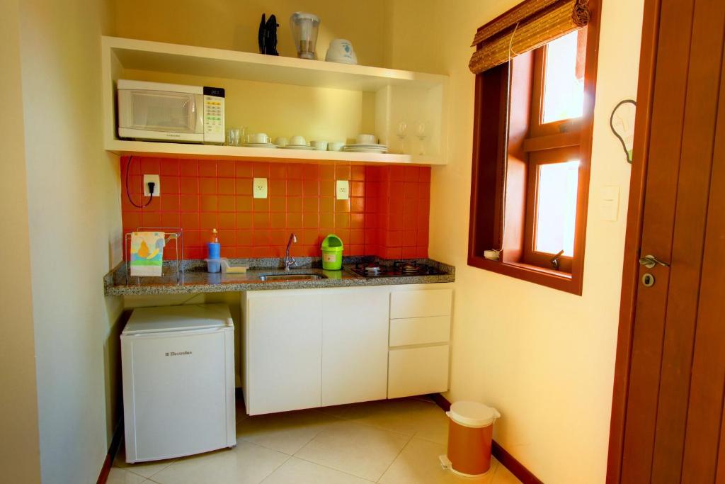 A cozinha ou cozinha compacta de Pousada Vila Boa Vida