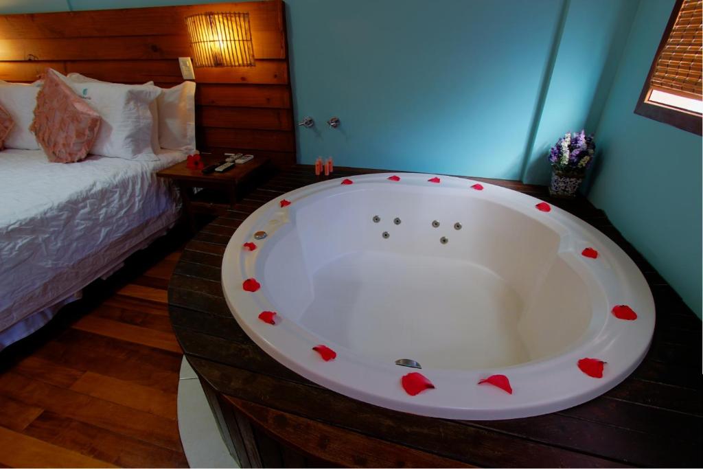 Cama ou camas em um quarto em Pousada Vila Boa Vida