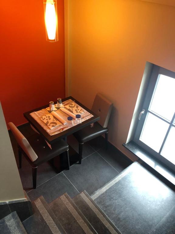 Posezení v ubytování La table d’Auguste