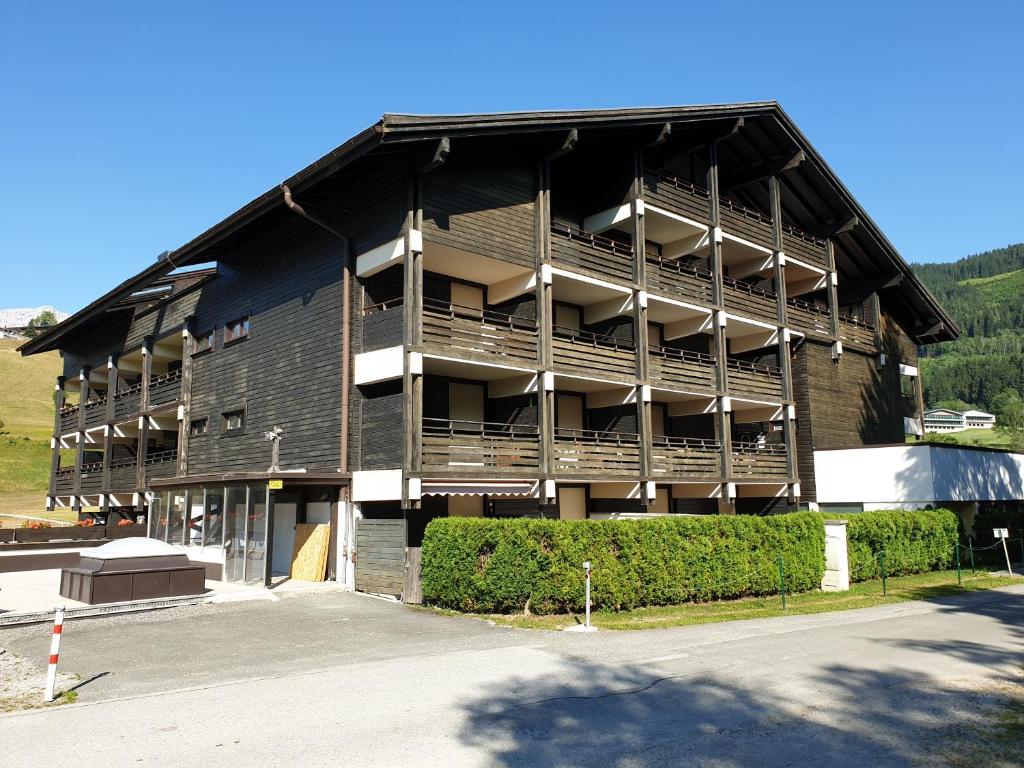 a large building with balconies on the side of it at Haus Anderl in Maria Alm am Steinernen Meer