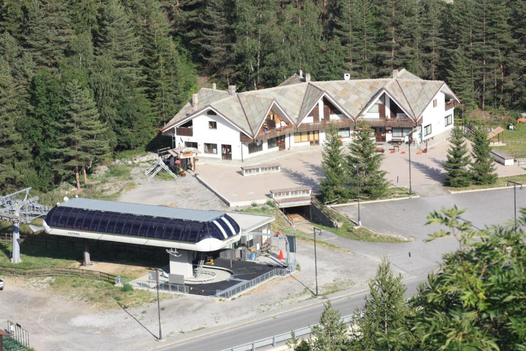 an aerial view of a large lodge with a building at Olympic Mountains in Cesana Torinese