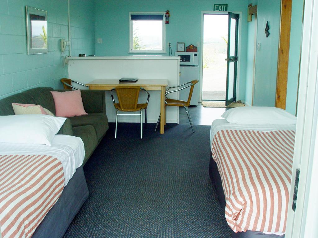 Postel nebo postele na pokoji v ubytování Mangonui Motel