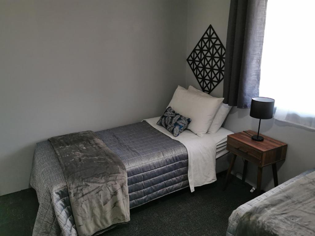 Postel nebo postele na pokoji v ubytování Limassol Motel