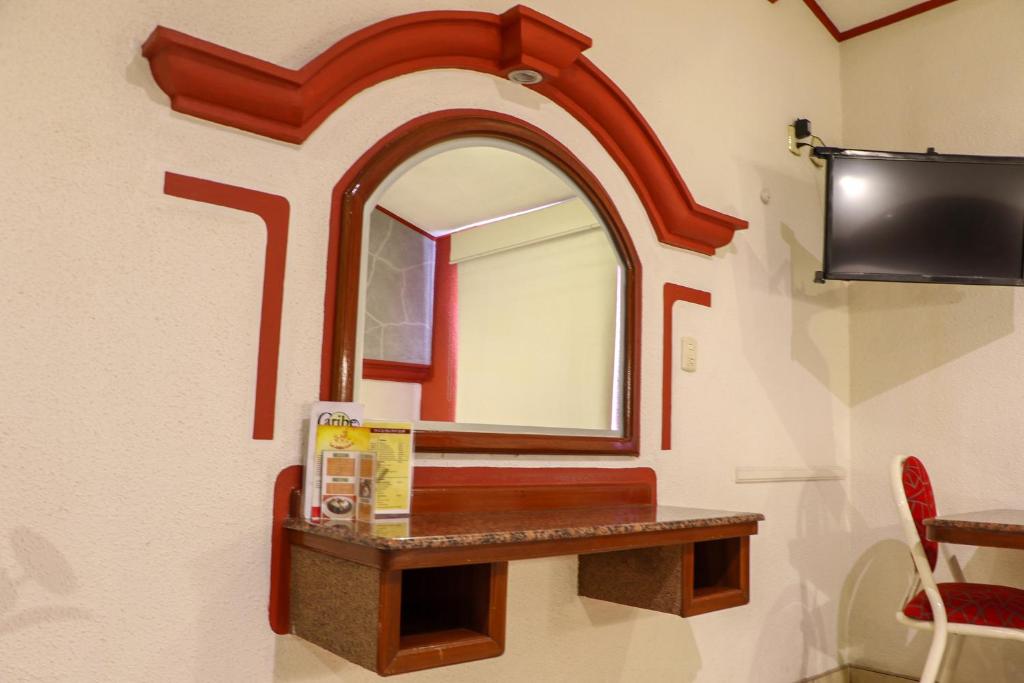 TV a/nebo společenská místnost v ubytování Motel Caribe
