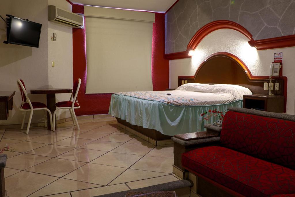 TV a/nebo společenská místnost v ubytování Motel Caribe