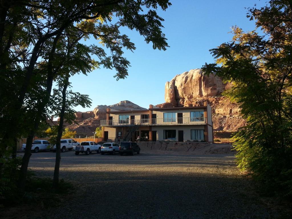 a building with a mountain in the background at La Posada Pintada in Bluff