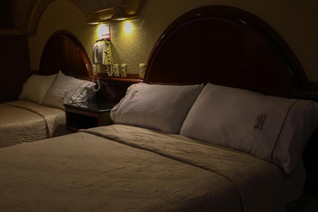 Postel nebo postele na pokoji v ubytování Motel Caribe