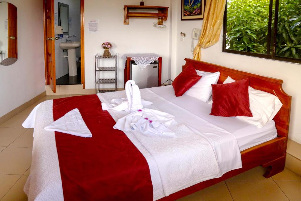 Postel nebo postele na pokoji v ubytování Hostal Sir Francis Drake