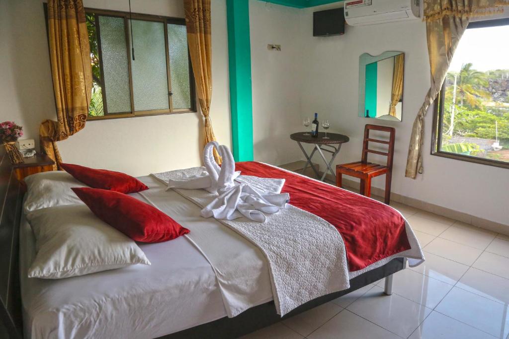 Postel nebo postele na pokoji v ubytování Hostal Sir Francis Drake