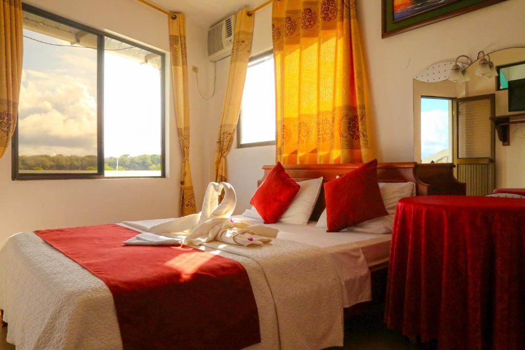 Postel nebo postele na pokoji v ubytování Hostal Sir Francis Drake