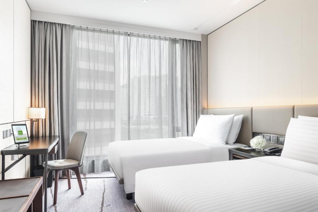A bed or beds in a room at ALVA HOTEL BY ROYAL