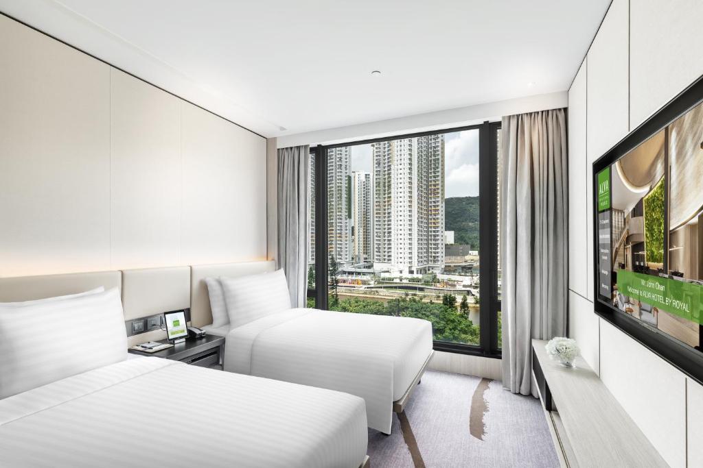 A television and/or entertainment centre at ALVA HOTEL BY ROYAL