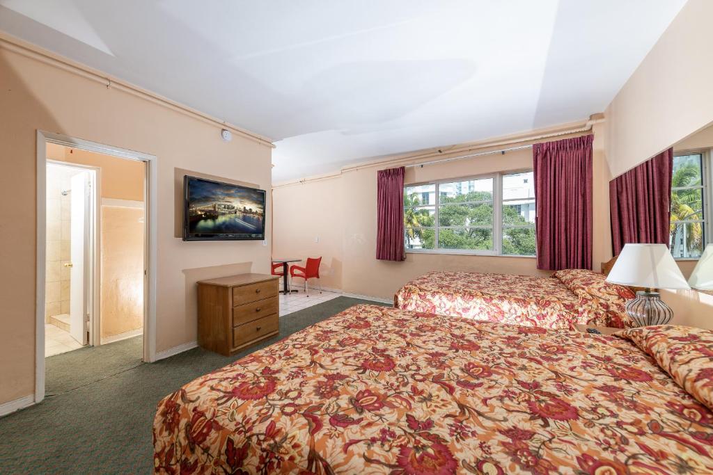 Postel nebo postele na pokoji v ubytování Ocean Beach Suites