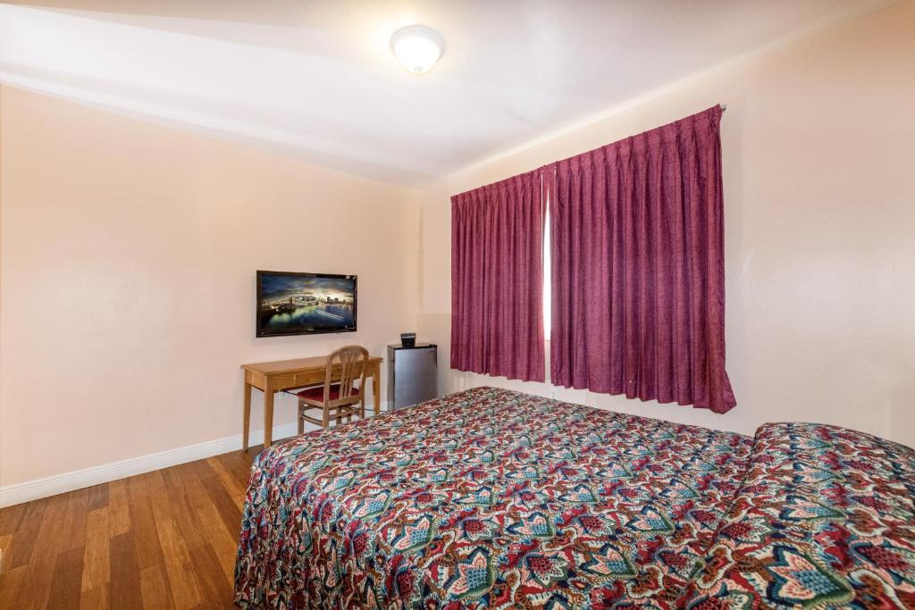 Postel nebo postele na pokoji v ubytování Ocean Beach Suites