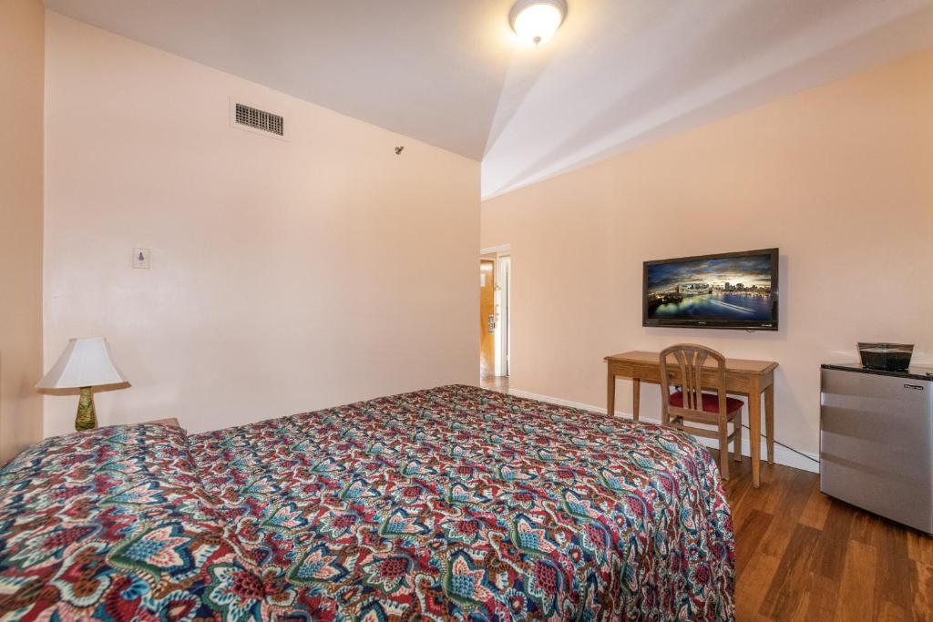 Postel nebo postele na pokoji v ubytování Ocean Beach Suites