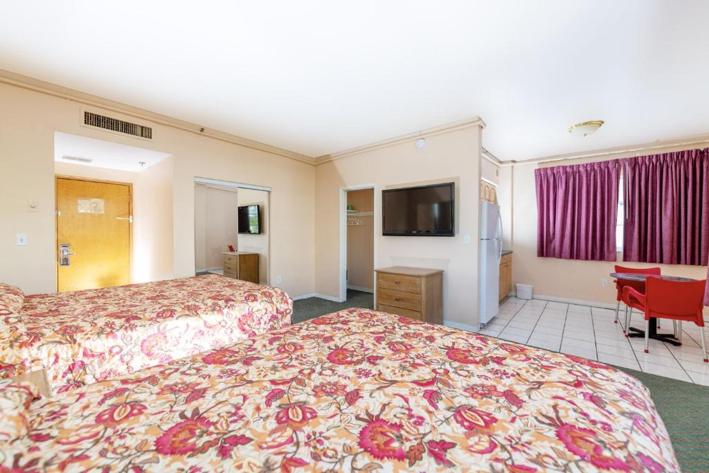 Postel nebo postele na pokoji v ubytování Ocean Beach Suites