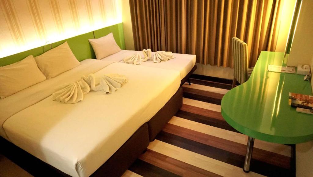 Pandanaran Hotel - ٠٠/١٥-٠٠/١٥ غرفة الأسرة