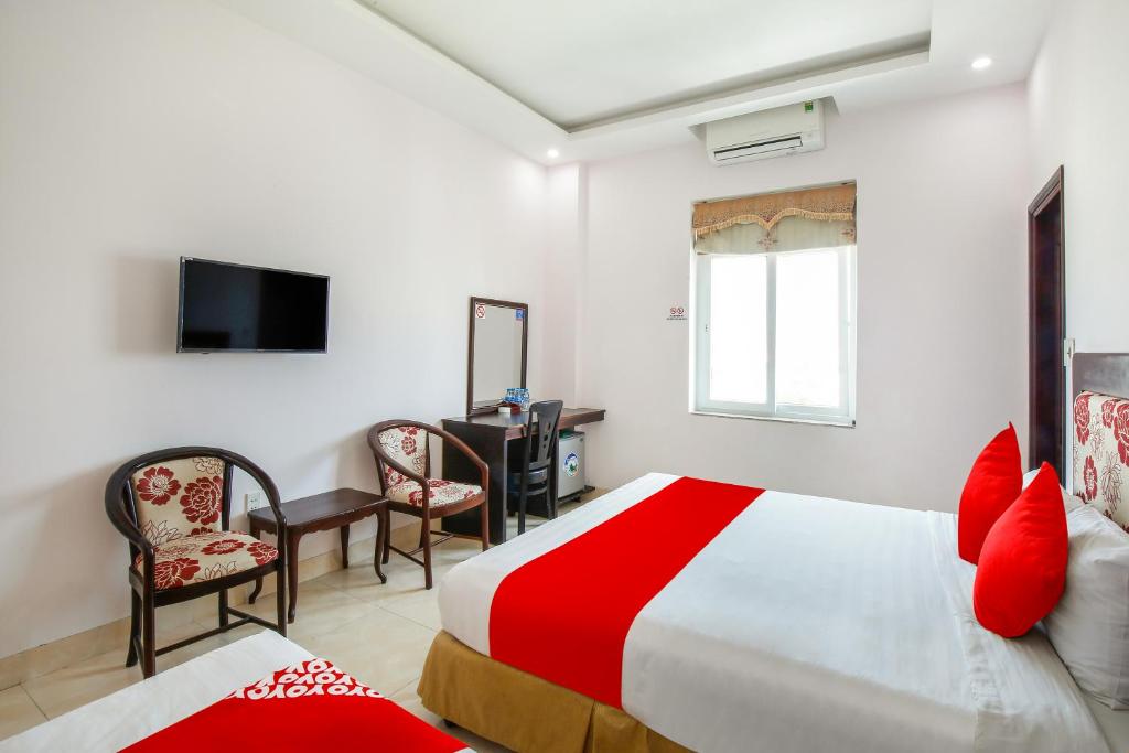 Postel nebo postele na pokoji v ubytování Areca Riverside Đà Nẵng