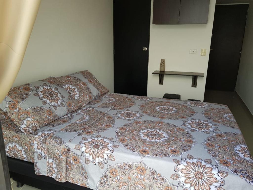 Cama o camas de una habitación en apartaestudio Medellín Belén
