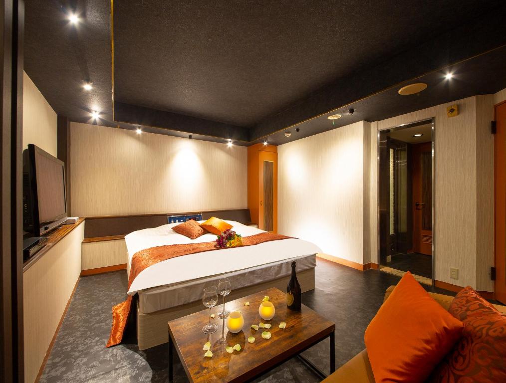 Postel nebo postele na pokoji v ubytování Hotel Gee (Adult Only)