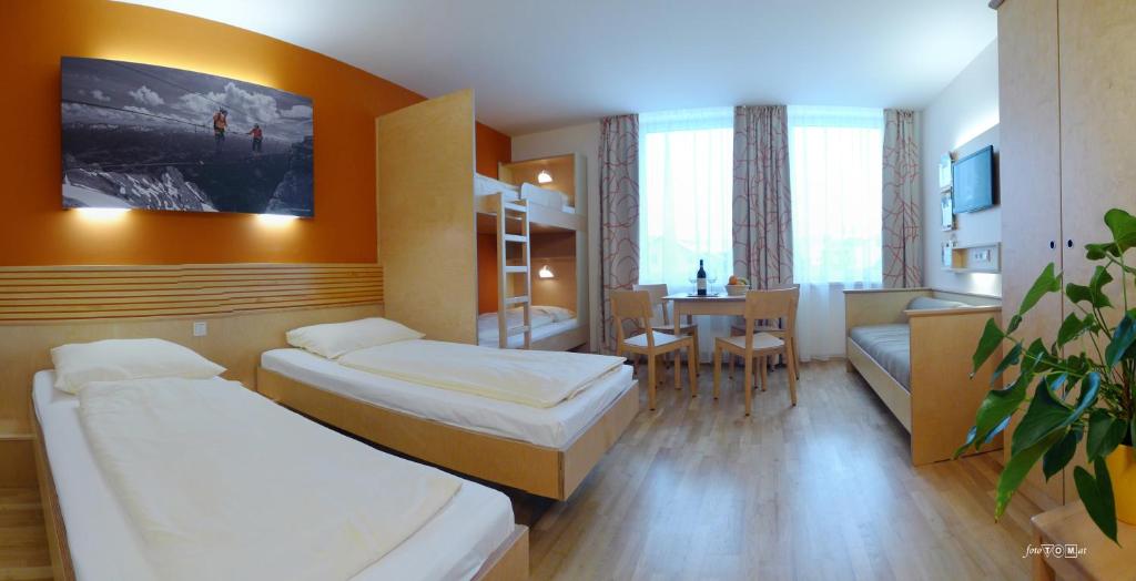 Postel nebo postele na pokoji v ubytování JUFA Hotel Grünau im Almtal