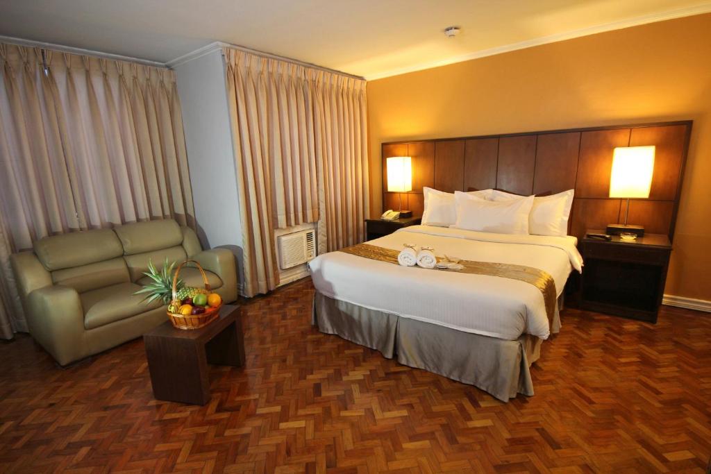 Postel nebo postele na pokoji v ubytování Comfy Inn Manila-Kalaw