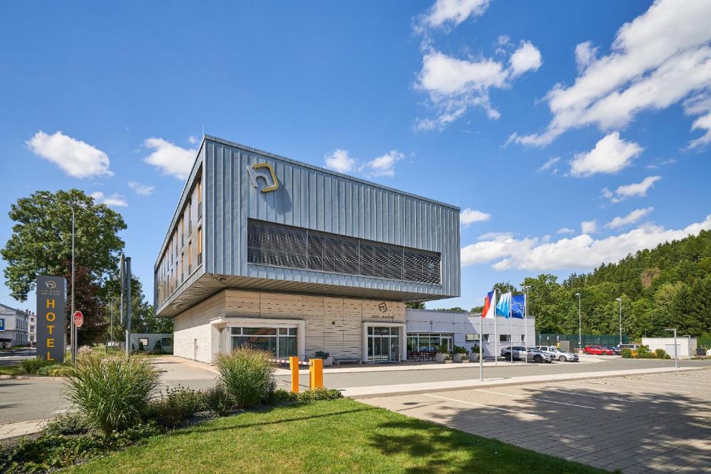 a building on the side of a road at Sport & Relax Hotel Davidek in Trutnov