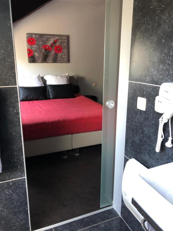 Postel nebo postele na pokoji v ubytování La table d’Auguste