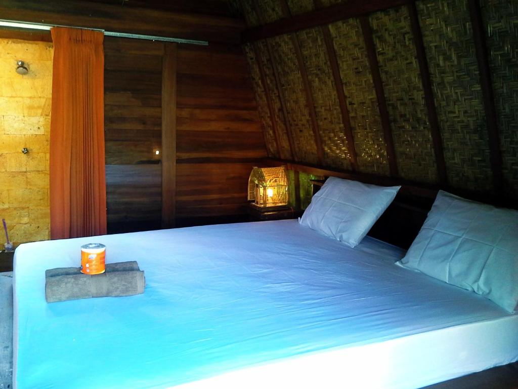 Ліжко або ліжка в номері Kelapa Gading Bungalows