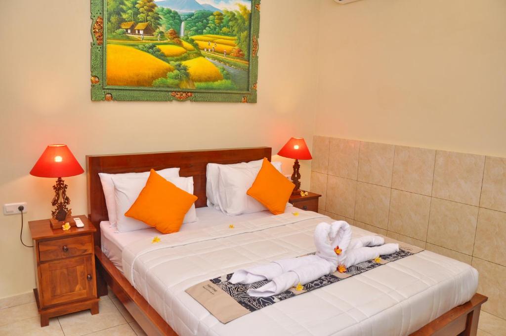 Postel nebo postele na pokoji v ubytování Dunung Sari Homestay