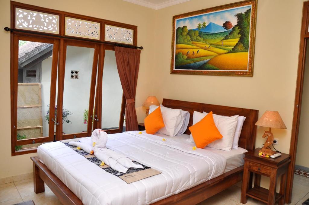 Postel nebo postele na pokoji v ubytování Dunung Sari Homestay