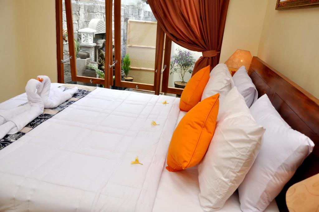 Postel nebo postele na pokoji v ubytování Dunung Sari Homestay